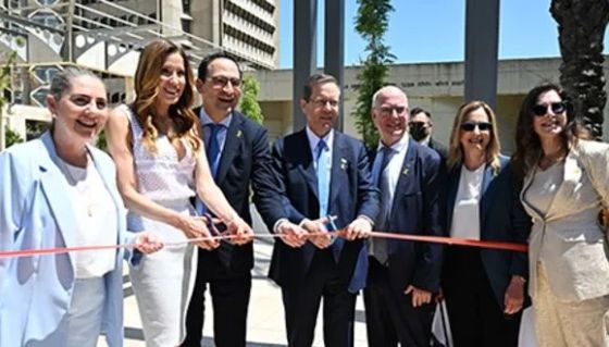 Cutting the ribbon to the new Gray Faculty of Medical & Health Sciences. From left: First Lady Michal Herzog, Mindy and Jon Gray, Israel's President Isaac Herzog, TAU President Prof. Ariel Porat, Medical Dean Prof. Karen Avraham, and Chairwoman of TAU Board of Governors Dafna Meitar-Nechmad. (Photo credit: Yuval Yosef)