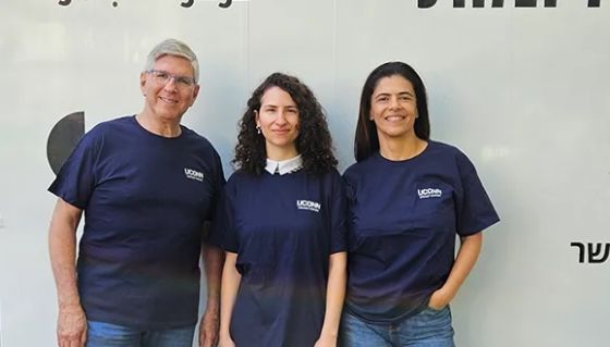 Yair Sakov and Eti Finkelstein, from TAU’s Entrepreneurship Center, are joined by hackathon winner Linor Neiman.