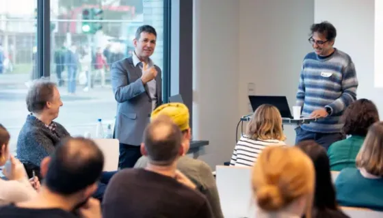 Prof. Tom Schonberg, co-organizer of the Winter School, and Prof. Roy Mukamel, from TAU’s School of Psychological Sciences, speak to the audience